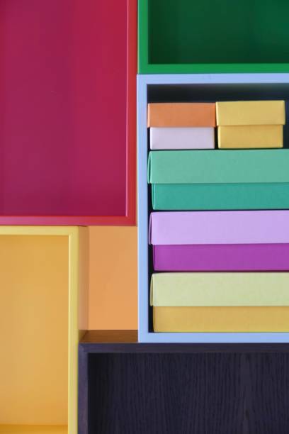 multi colored boxes in the shelf - shelf bookshelf empty box imagens e fotografias de stock