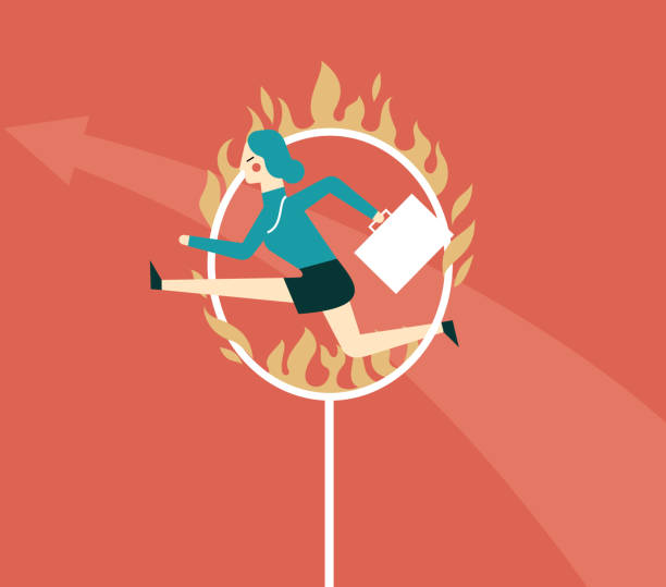 istock Jumping through hoop - businesswoman 973761412