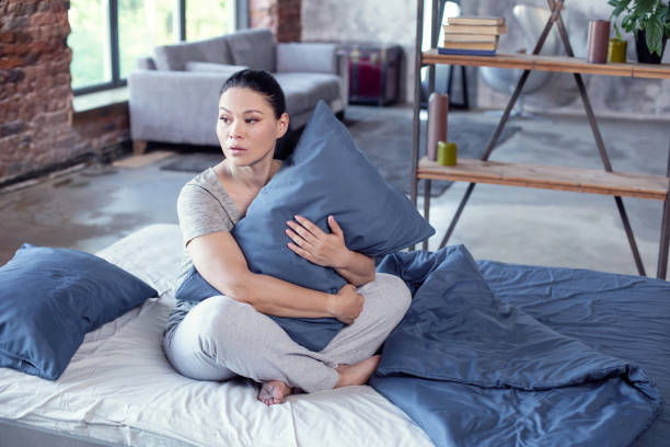 istock Upset beautiful woman experiencing sleep disorder 973761462