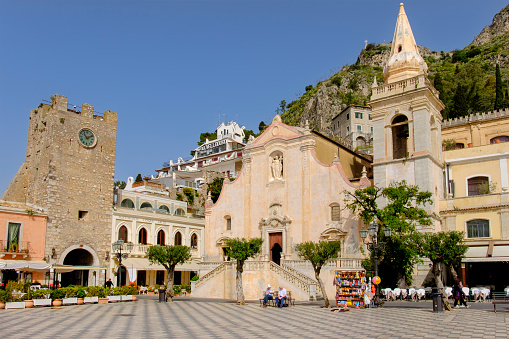 Piazza IX Aprile is the core in the historic centre of Taormina, a very popular tourist destination on the east coast of Sicily. On the square faces the Church of San Giuseppe, built between the seventeenth and eighteenth centuries. People.