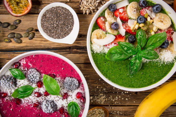 istock Smoothie bowl with fresh berries, nuts, seeds, fruit and vegetables 973762420