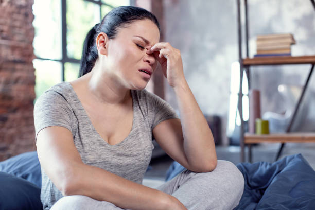istock Tired dreary woman demonstrating headache 973766846