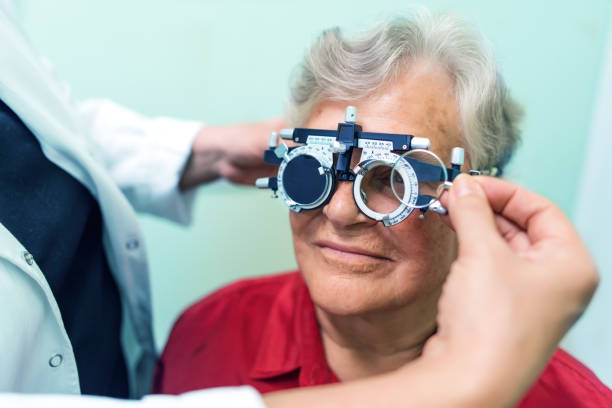 istock Senior woman having her eyes checked at ophthalmologist 973766962