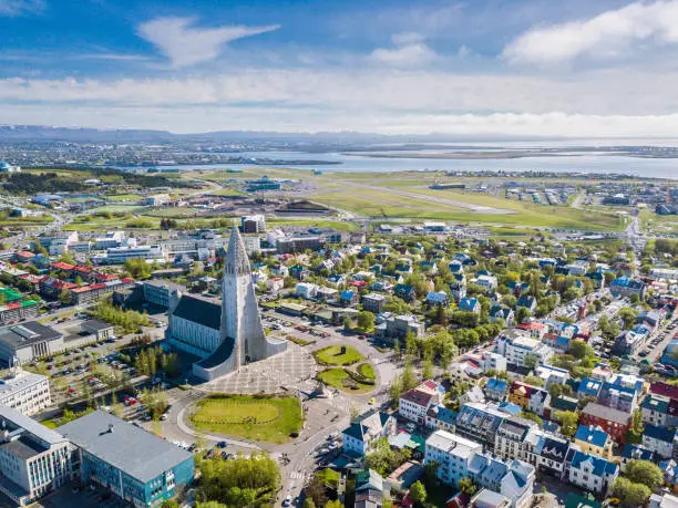 Photo of Reykjavik city scape frop the top with Hallgrimskirkja church. Aerial photo. religious building