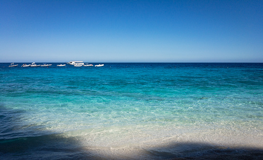 Blue water at Cala die Gabbiani beach on the Italian island of Sardinia