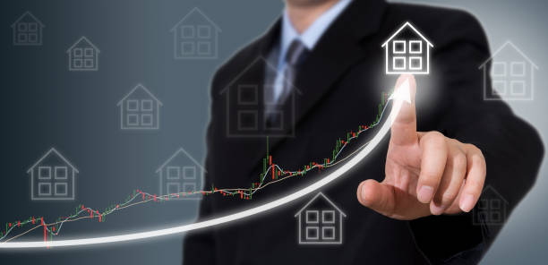 Businessman Touching a Graph Indicating Growth stock photo