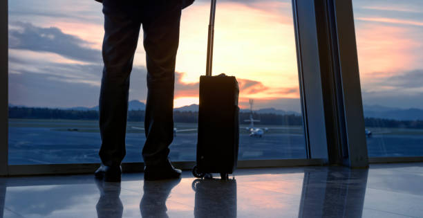 istock Businessman standing at airport 973783152