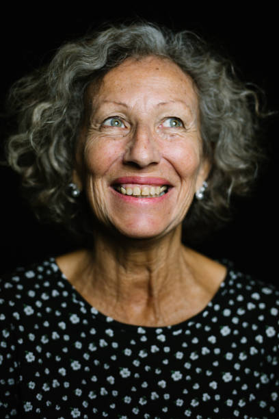 istock Senior Woman Smiling While Looking Away 973788120