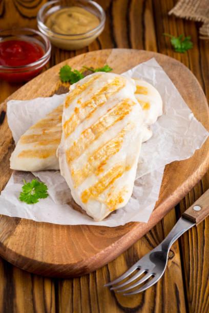 istock Grilled chicken fillet, mustard and ketchup 973793144