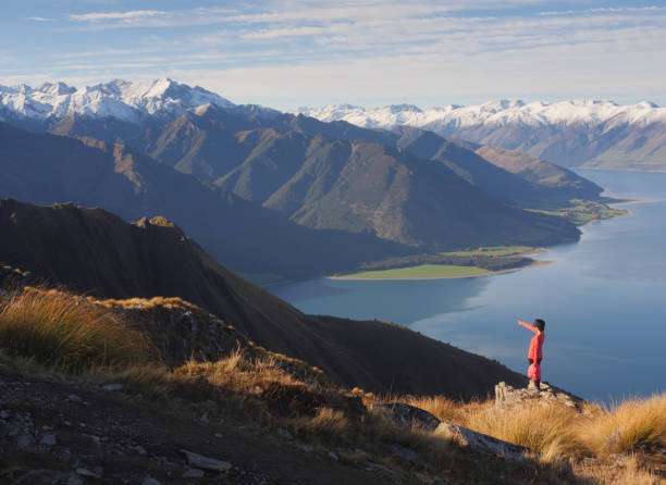 istock Young woman viewing mountain landscape 973833040
