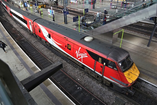 People board Virgin Trains train at Leeds Station in the UK. The railway station served 28.8 million passengers in 2015.