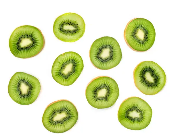 Photo of Kiwi fruit Slices macro.  Ripe Kiwi fruit isolated on white background. Fresh tropical abstract background