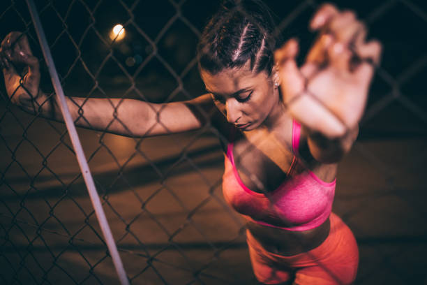 istock Woman resting after training outdoors 973844664