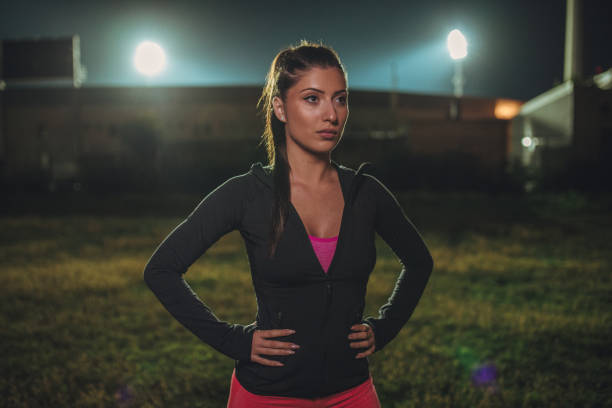 istock Sporty woman at night 973849406