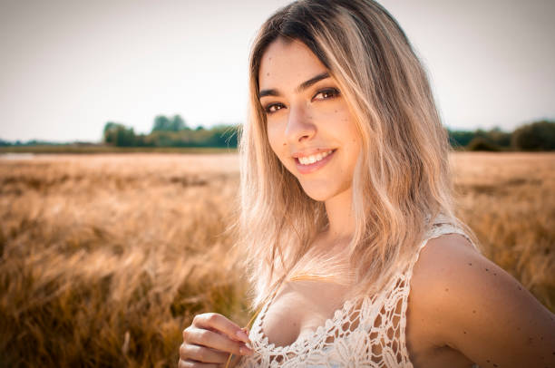 istock Blonde girl in cornfield 973851222