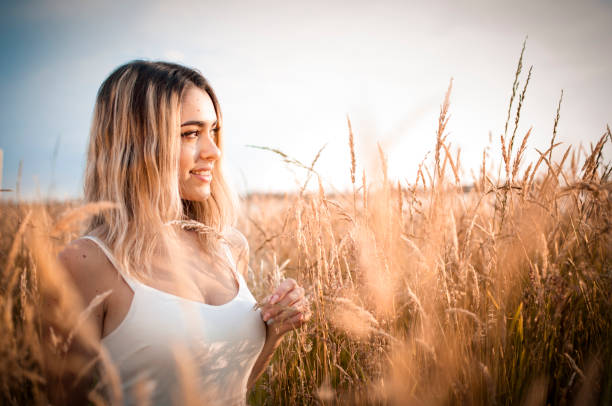 istock Blonde girl in cornfield 973851468