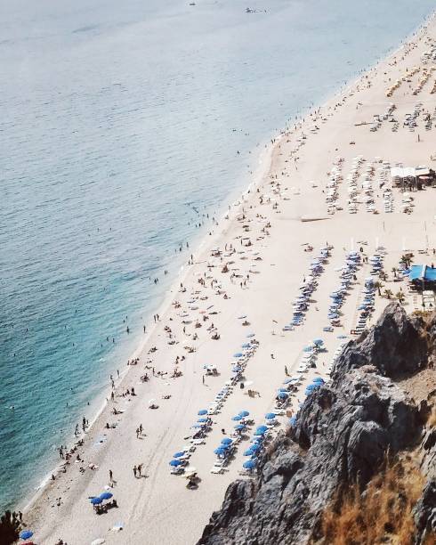 istock Sea coastline and beach with people in Turkey 973852242