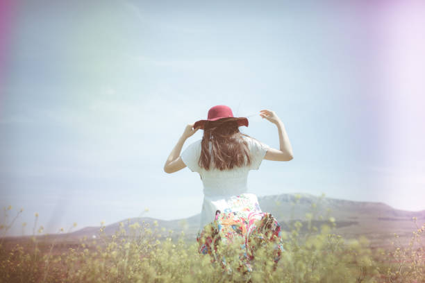 istock a young woman in the spring 973858456