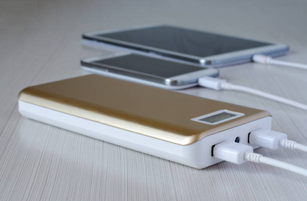 istock Powerbank charges the smartphone and tablet computer. Close up 973861774