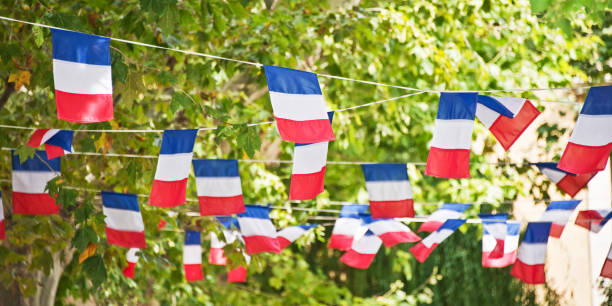 istock French flags garland decorating a village square 973867070