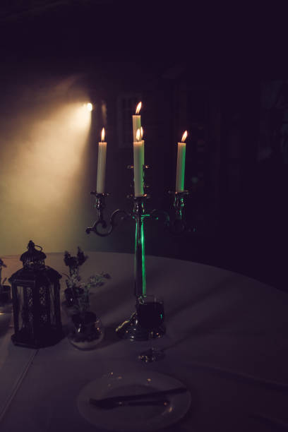 istock Metal retro candlestick with burning candles 973881272