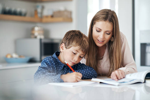 istock Taking a keen interest in his education 973890868