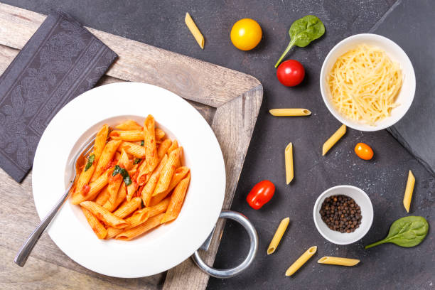 Gluten free pasta and ingredients for cooking. Healthy eating concept Gluten free pasta and ingredients for cooking. Healthy eating concept. Horizontal vodka sauce stock pictures, royalty-free photos & images