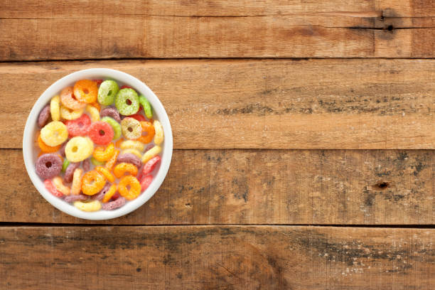 istock Multi colored cereal rings with milk 973899226