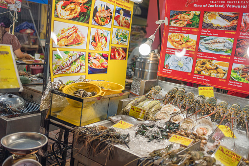 Seafood panorama. Fresh fish and sea food on ice, overhead flat lay panoramic banner. A market or a restaurant menu. Shellfish, scallop, and lime