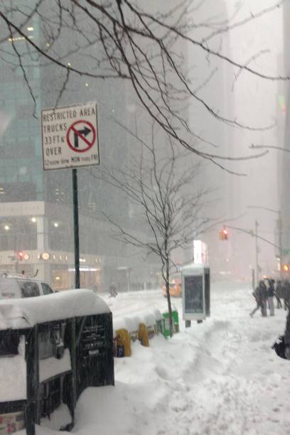 istock Snowing in City 973902704