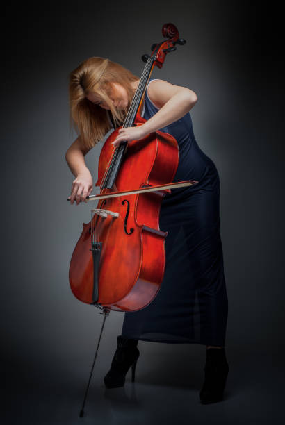 istock Female Cellist Playing Cello 973905180