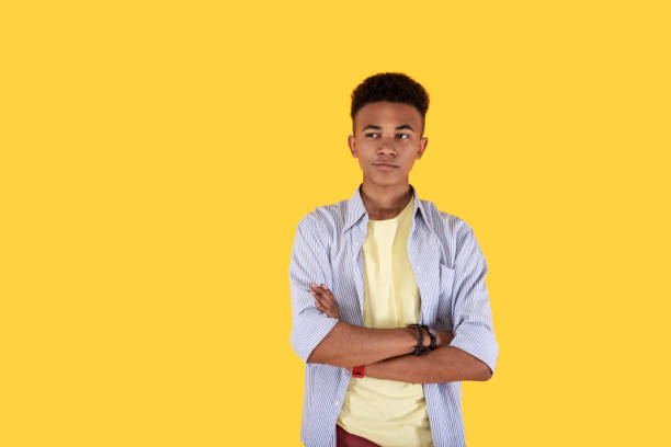 istock Pleasant good looking man standing cross handed 973906158