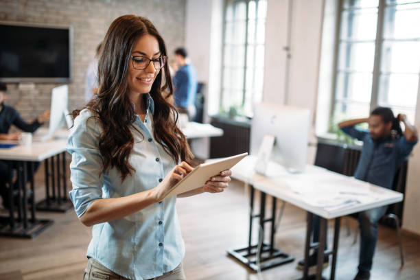 istock Young attractive architect working in modern office 973906386
