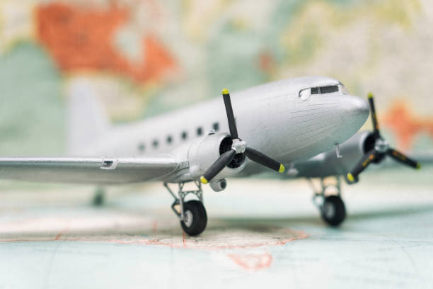 istock Plane On Vintage World Map 973906572