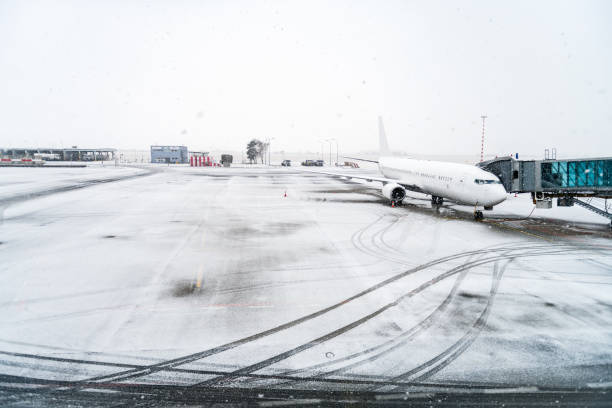 istock Airplane & airport in winter 973911758