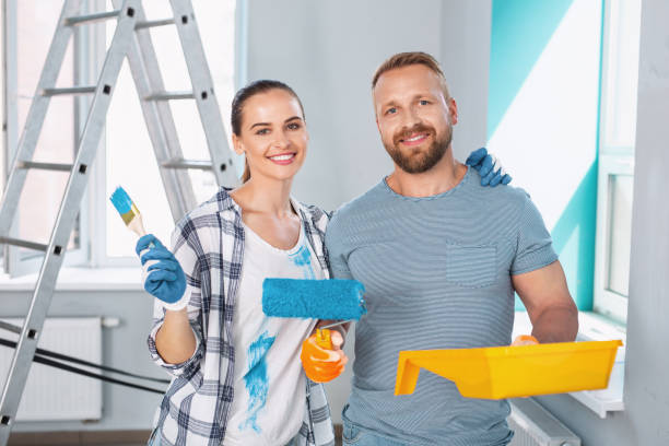 istock Inspired skilled painters standing together 973912684