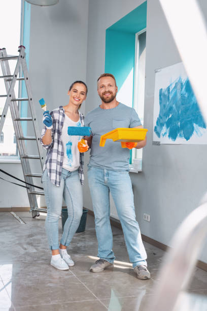 istock Joyful skilled painters standing together 973913024