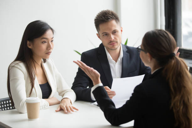 istock Skeptical diverse hr managers interviewing female applicant, bad first impression 973913314