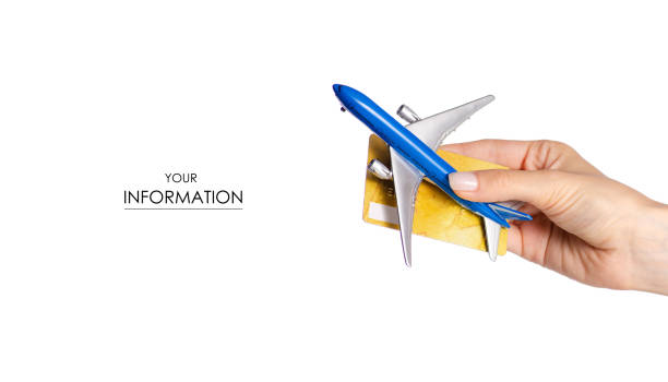 istock Miniature airplane payment card in hand travel pattern 973919322