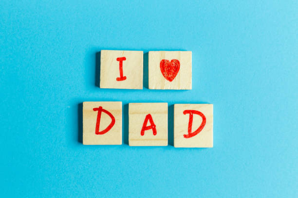 istock alphabet on small plate on Blue background  for Father ’s day image 973923796