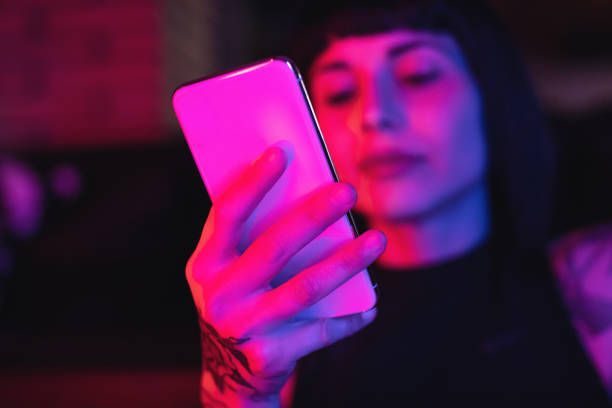 istock Young Woman Typing Phone Message 973924082