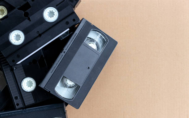 istock old video tape on brown paper background. top view 973934242
