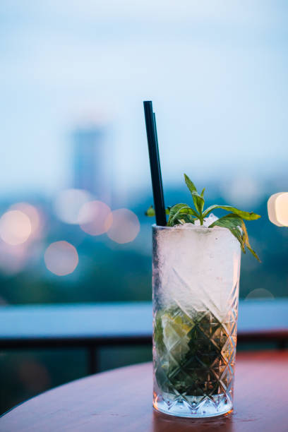 istock Mojito on wooden table at roof bar 973934340