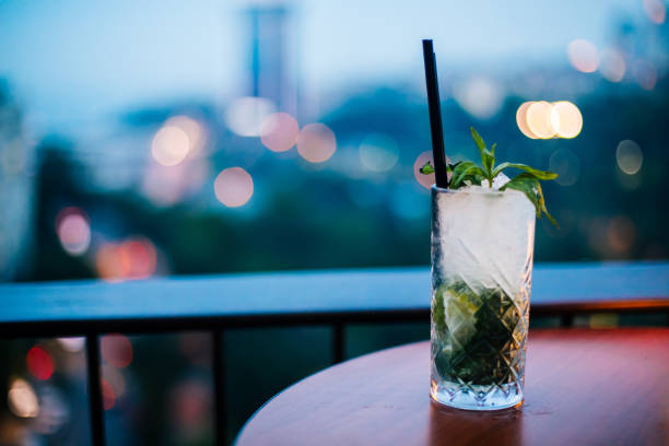 istock Mojito on wooden table at roof bar 973934962