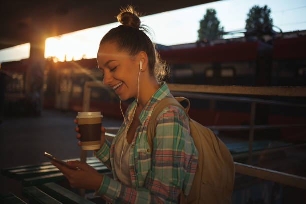 istock Surfing the net on train station 973952654