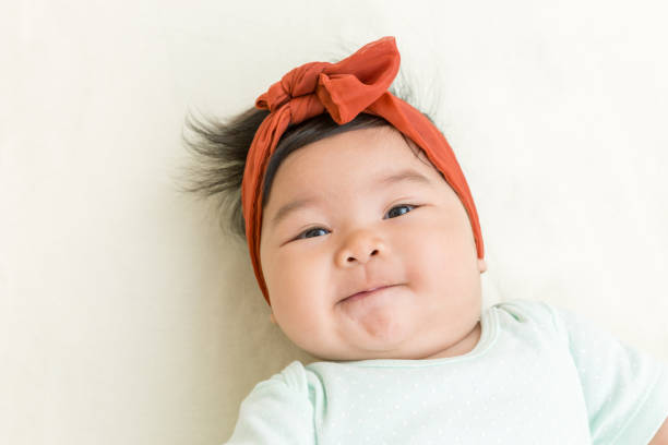 Adorable Asian Baby Smiling On The Bed Stock Photo - Download Image Now -  Baby - Human Age, Baby Girls, Asia - iStock
