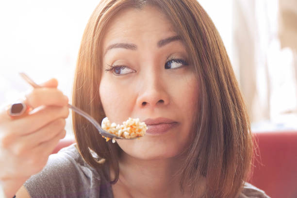 istock Asian woman having lunch 973957054