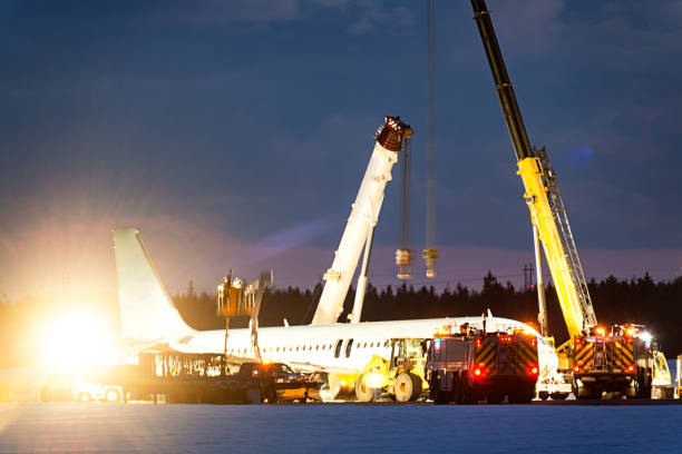 Plane Crash Site Recovering a passenger jet from a runway after a hard landing. airplane crash stock pictures, royalty-free photos & images