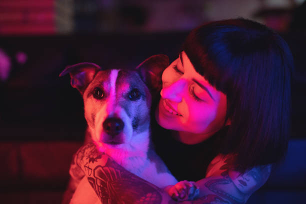 istock Beautiful young woman with dog 973977688