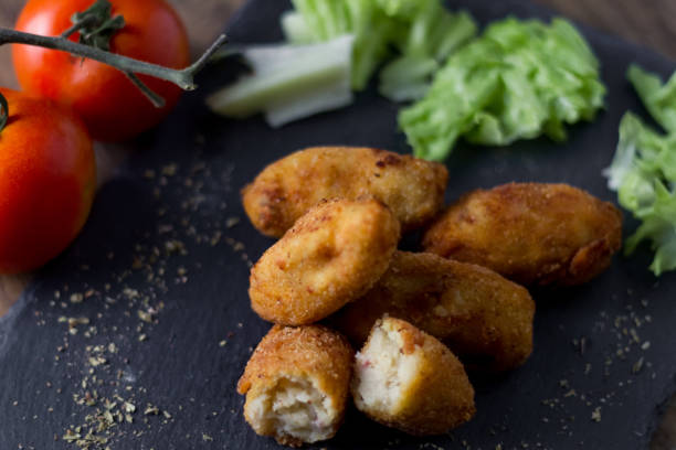 istock ham croquettes and cooked with vegetables in the background 973982666